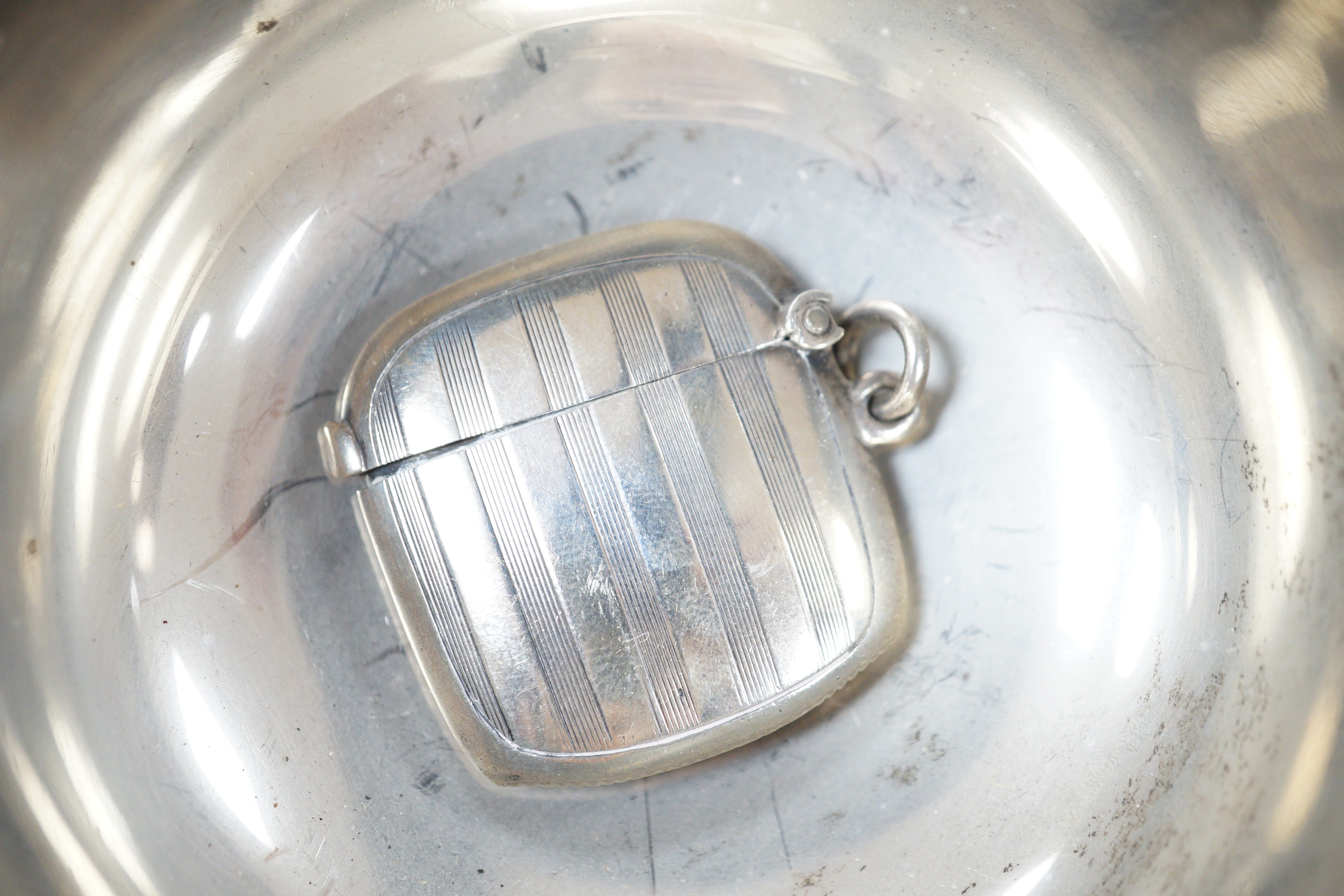 Small silver including a George V quaich, Edinburgh, 1928, a pair of condiments, circular box and cover, mug, toilet jar and three items of cutlery.